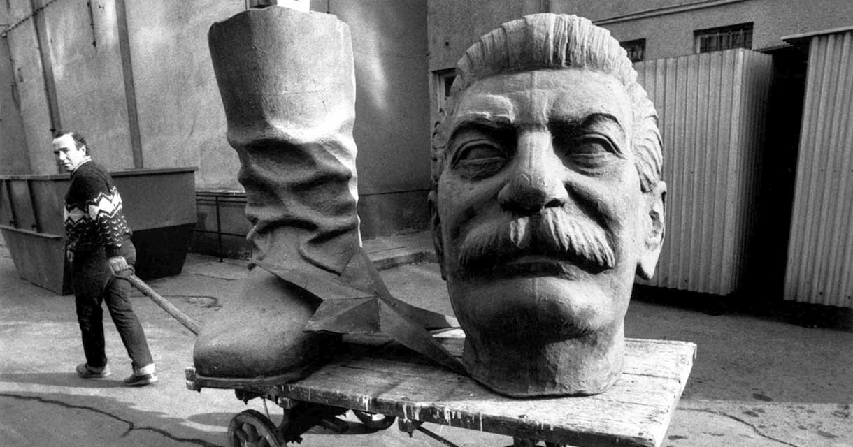 A statue of Stalin is carted away after the fall of the Soviet Union
