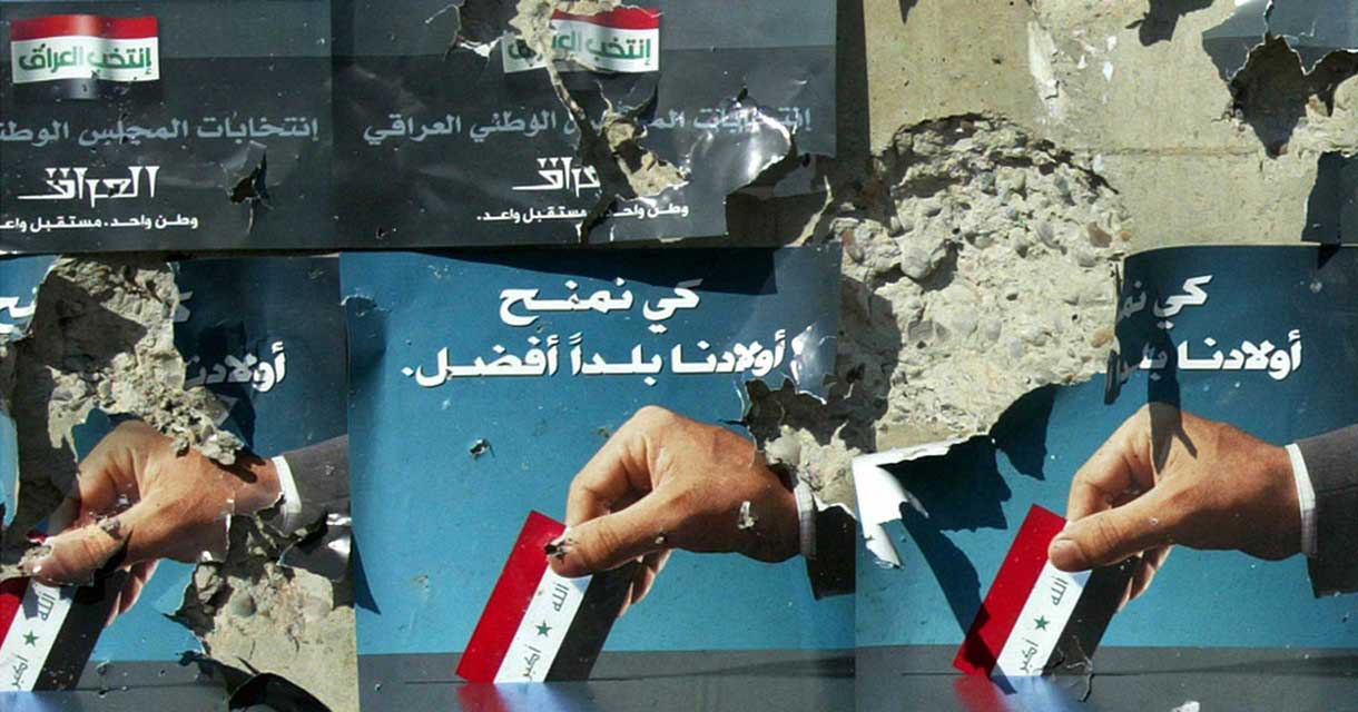 Posters invite Iraqis to participate in a general election